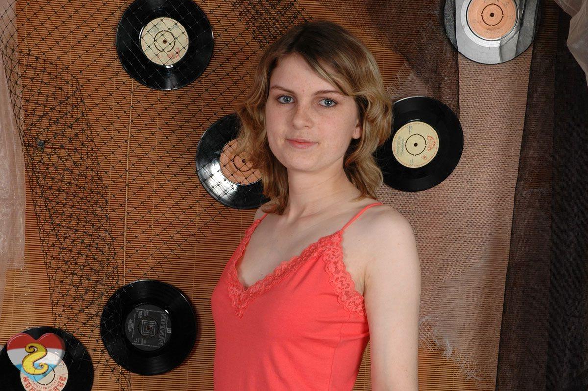 15P Very cute teen showing off her tits