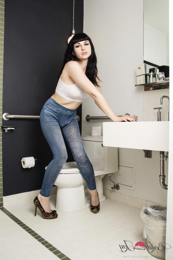 12P Bailey Jay shows off her fat shecock in the toilet