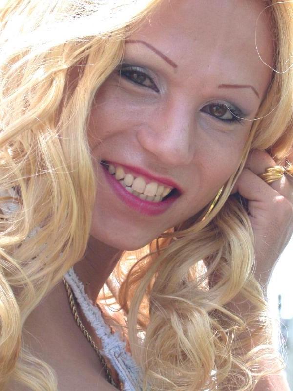 20P Busty blonde tranny strip teasing outdoors