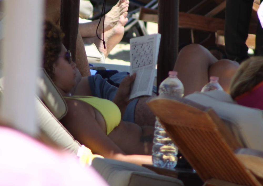 9P Girl with curly hair big tits and areola topless Mykonos