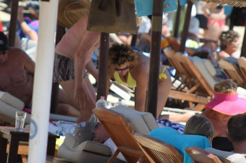 9P Girl with curly hair big tits and areola topless Mykonos