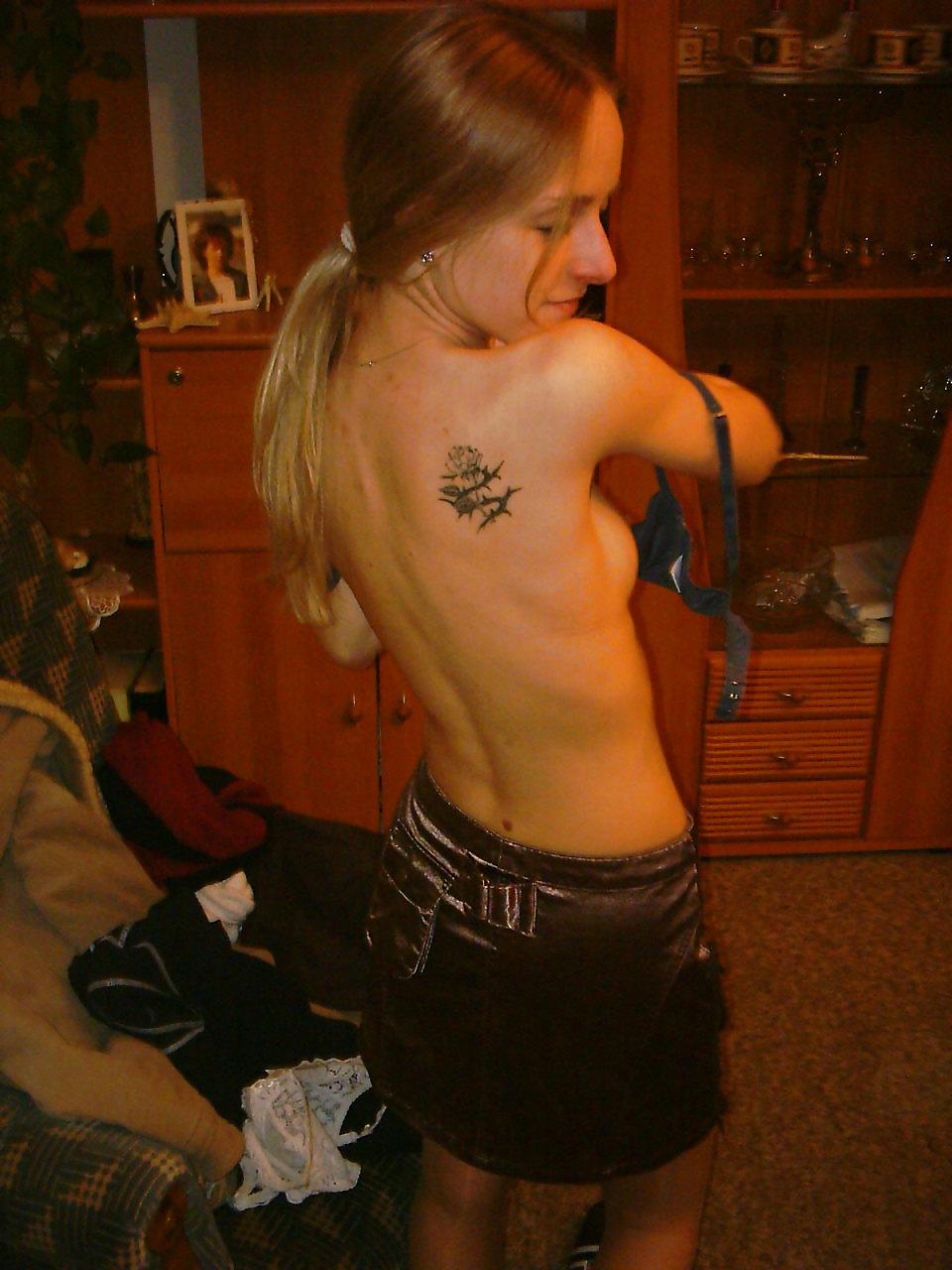 16P Cute blonde girl strips