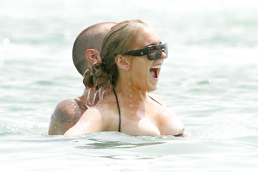 21P Lindsay Lohan ... Nipple In Black Bikini