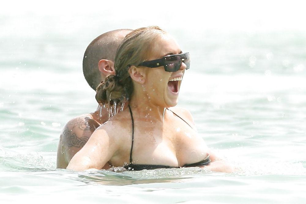 21P Lindsay Lohan ... Nipple In Black Bikini