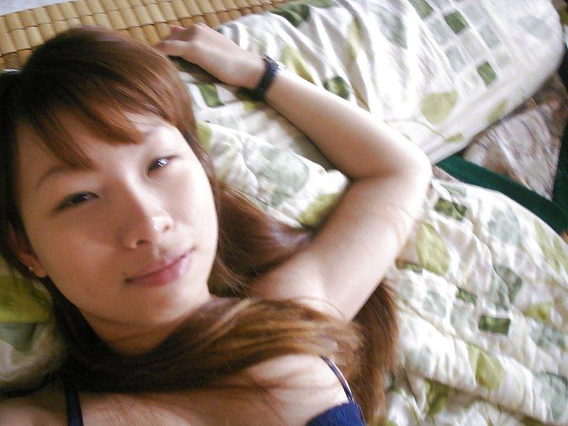 7P Cute asian girl shows her hot body