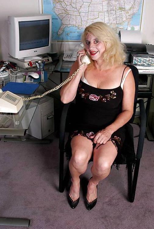 18P Blonde granny undressing by her computer