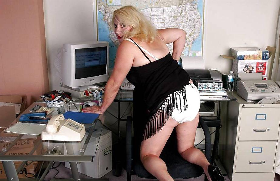 18P Blonde granny undressing by her computer