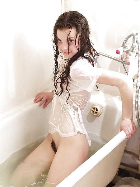 25P Sweet wetlook girl under the shower with her clothes on