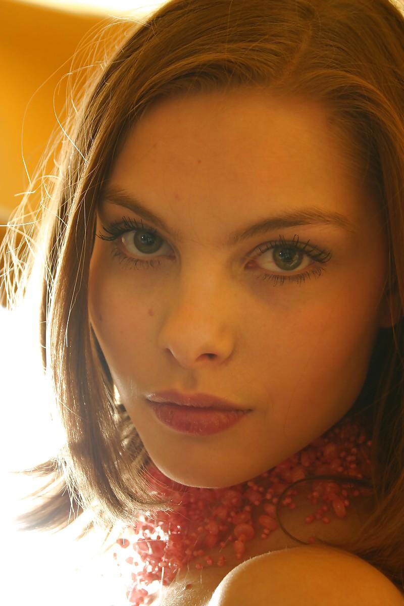 12P Brunette Lili posing in a kitchen