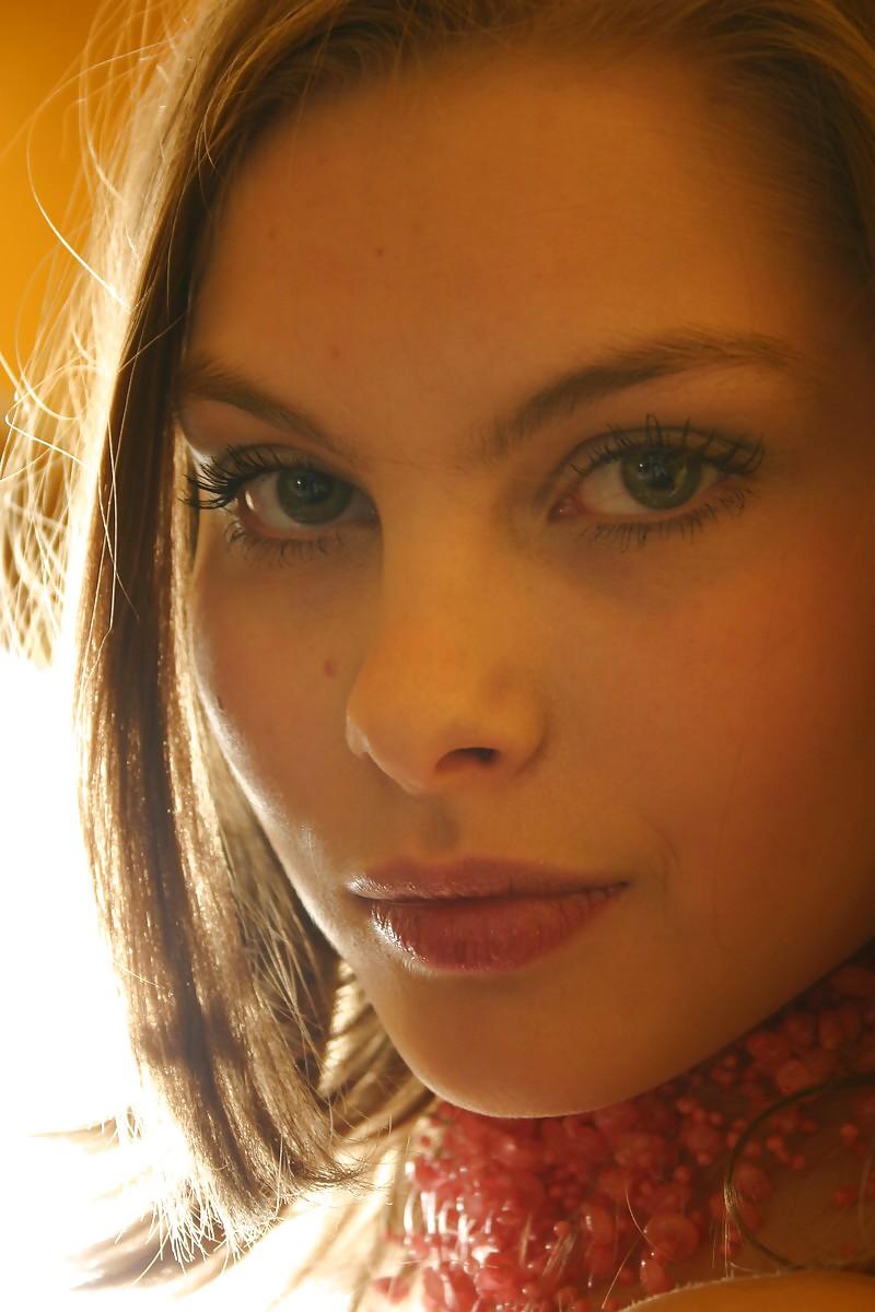 12P Brunette Lili posing in a kitchen