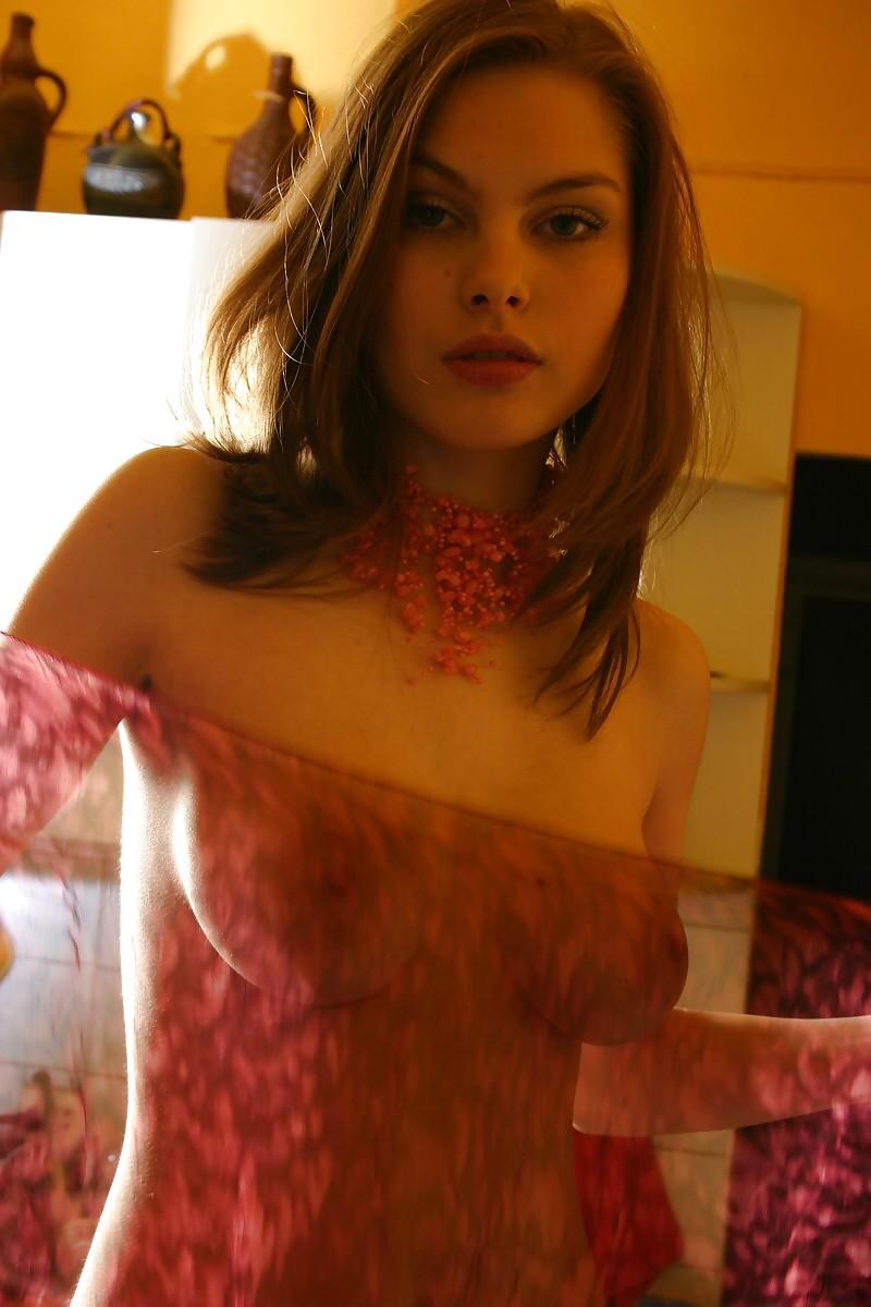 12P Brunette Lili posing in a kitchen