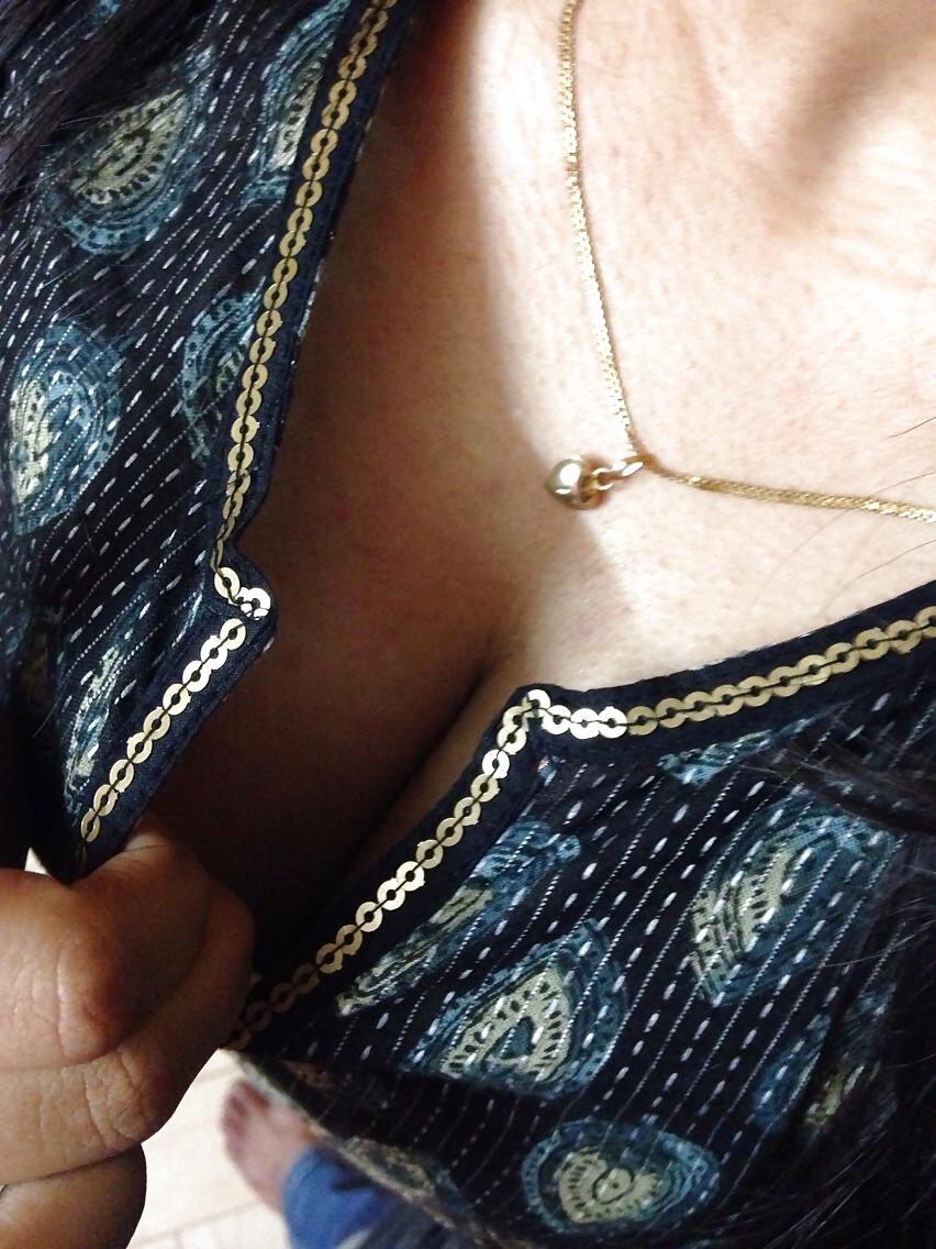 8P Her cleavage ...