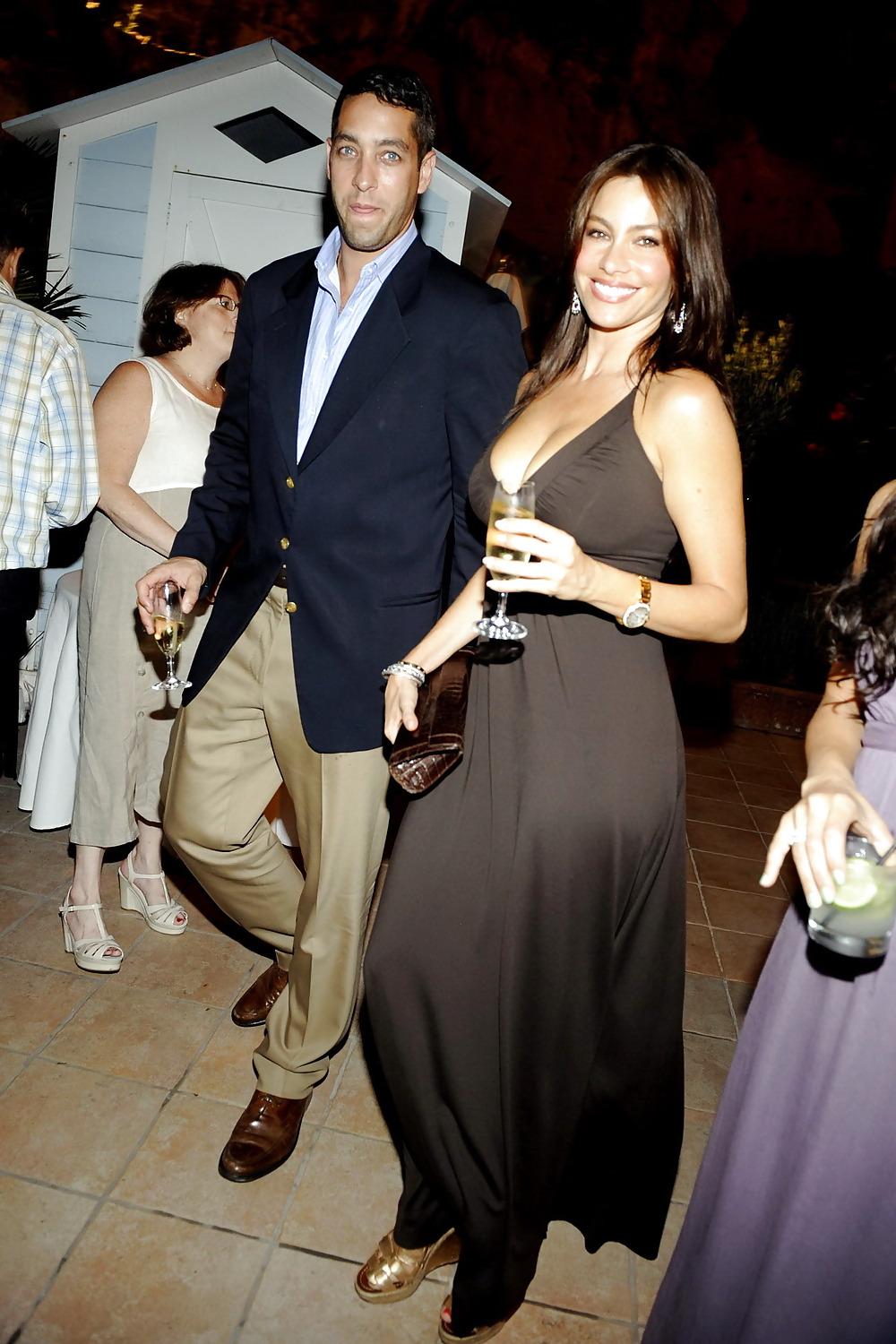 15P Sofia Vergara enjoys a glass a bubbly huge cleavage
