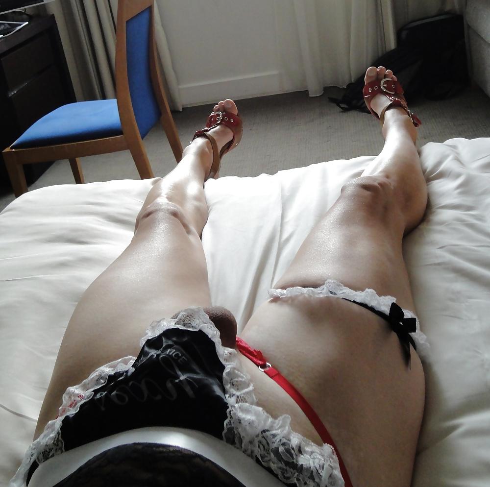 16P Tranny laying in bed, showing her hard cock