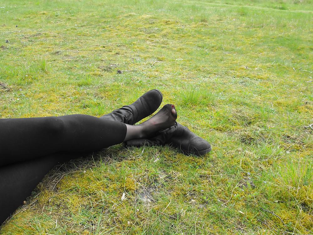 12P Em showing her sexy feet in the forest in black tights