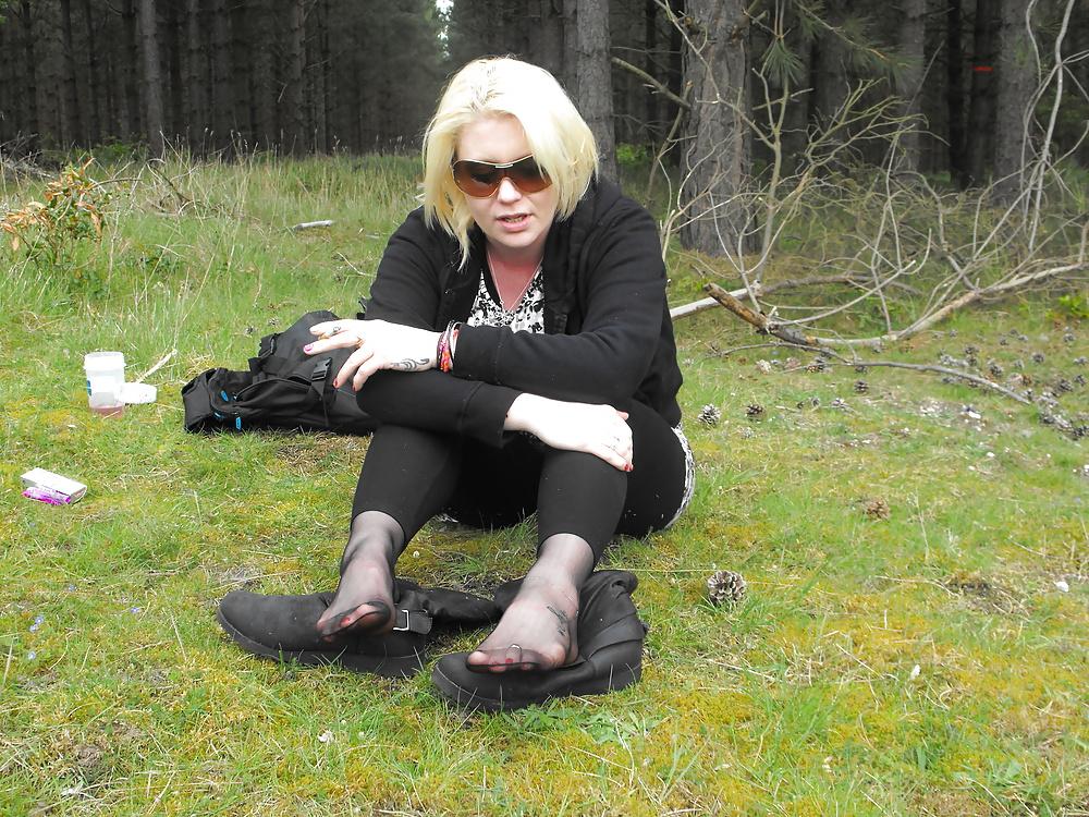 12P Em showing her sexy feet in the forest in black tights
