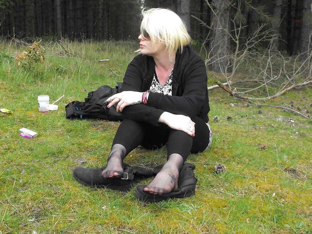 12P Em showing her sexy feet in the forest in black tights