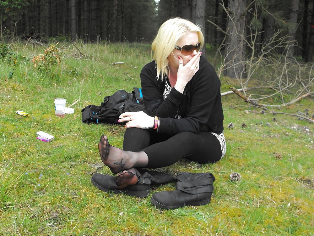 12P Em showing her sexy feet in the forest in black tights