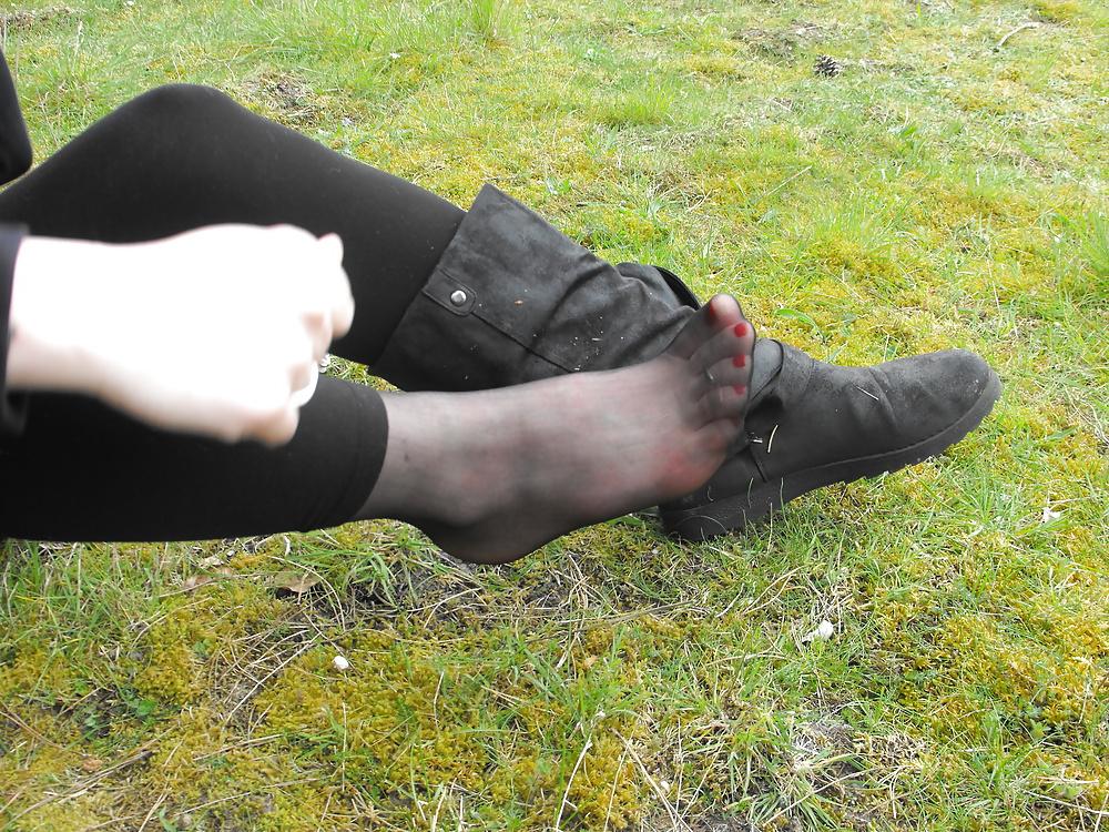 12P Em showing her sexy feet in the forest in black tights