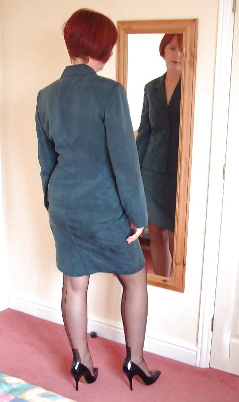 25P Amateur redhead lady strips slowly