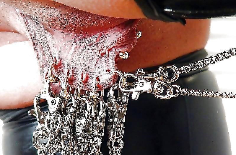 11P Females with weights hanging from their labia...