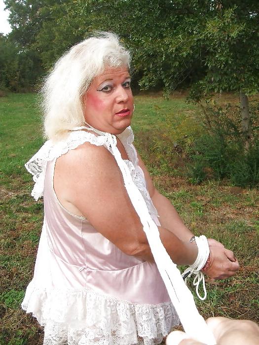 25P Sissy male pansy tied to a tree in public