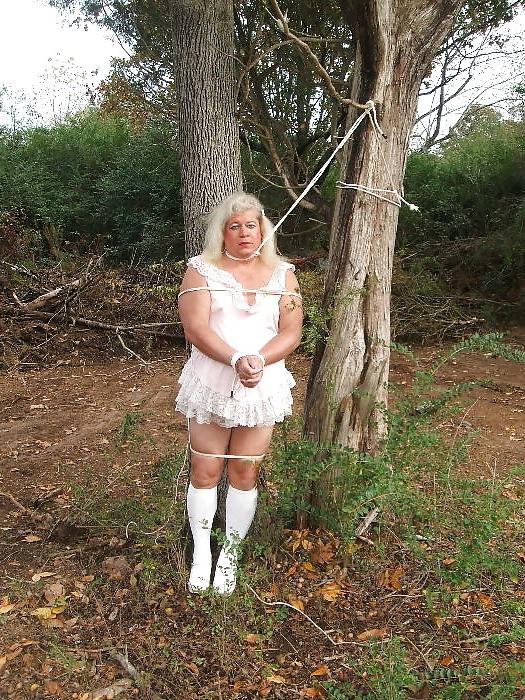 25P Sissy male pansy tied to a tree in public