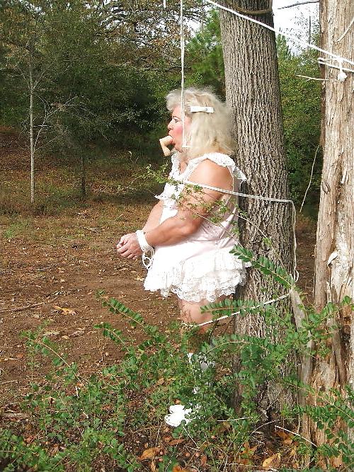 25P Sissy male pansy tied to a tree in public