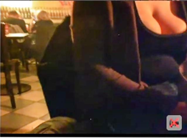 13P Big boobed chick flashes in a public pub