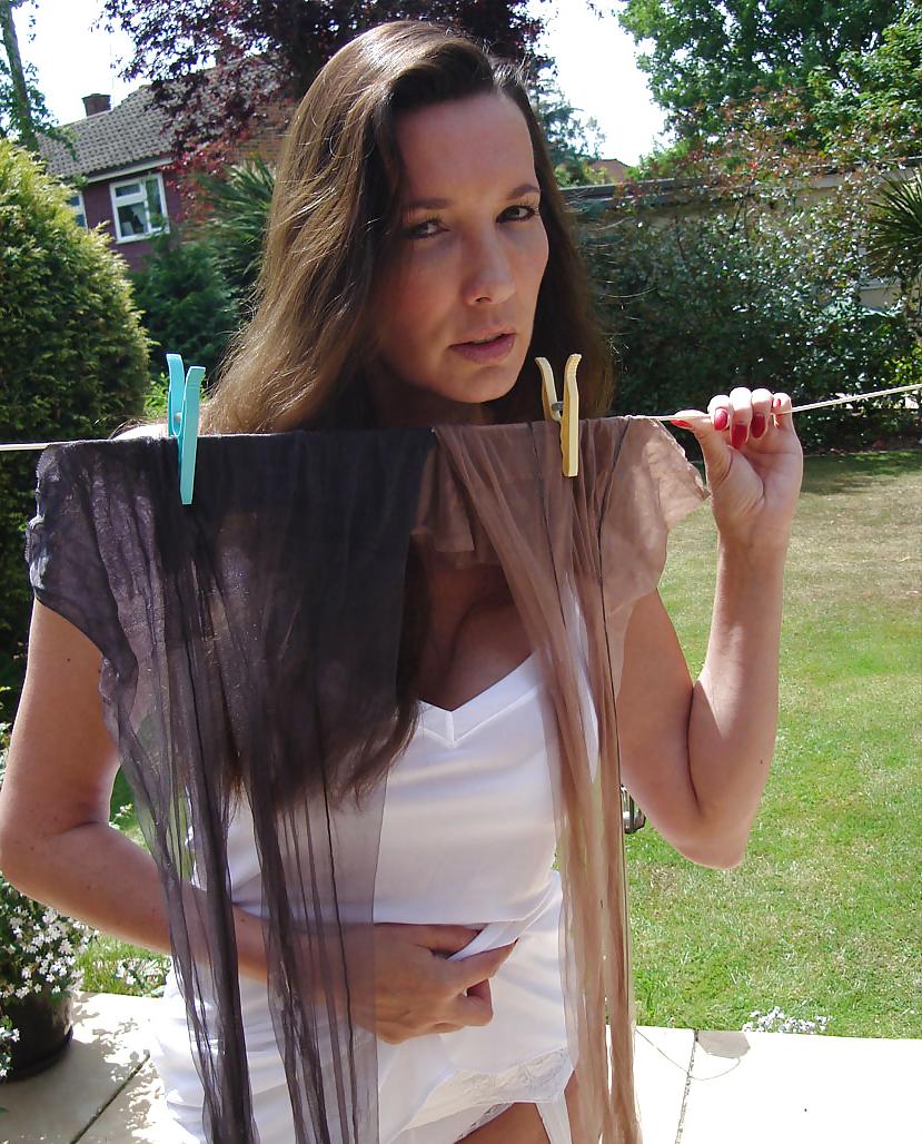 13P Strong lady in slip hangs washing
