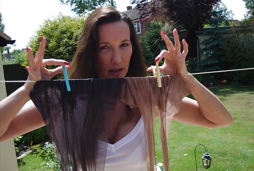 13P Strong lady in slip hangs washing