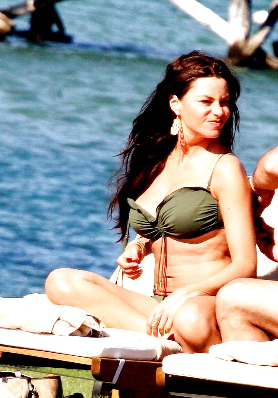 14P Sofia Vergara showing huge ass & cleavage in a white bikini