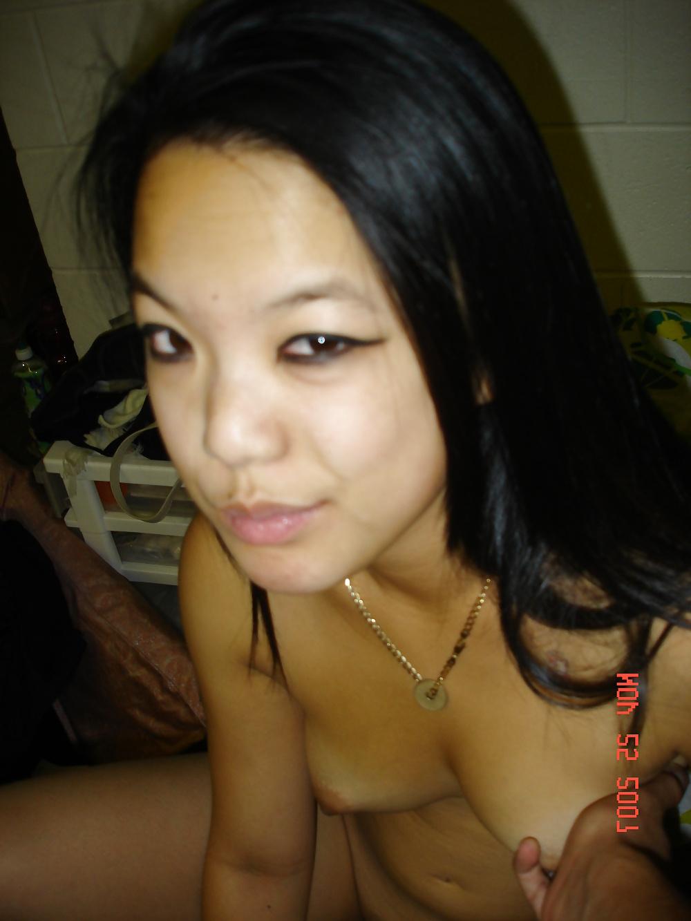17P Asian girl spreads her pussy in her dorm room