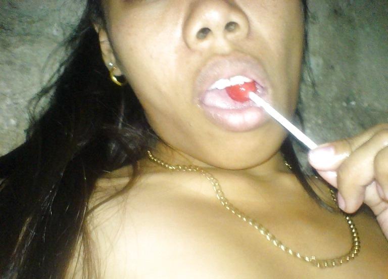 16P Asian slut sticks lollipop up poontang