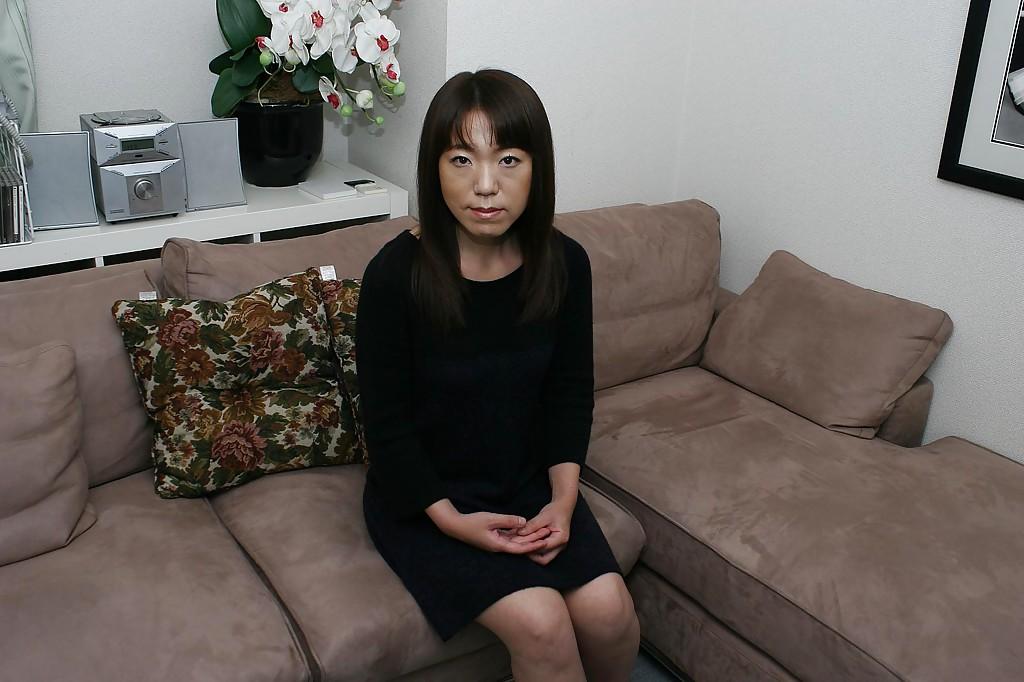 16P Clothed beauty Kazue Hamano is revealing her Asian hairy pussy in close up