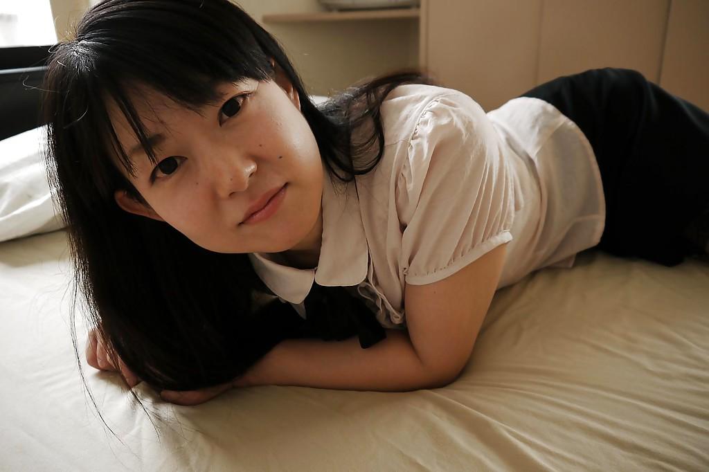 16P Asian babe Ayane Ikeuchi posing in skirt and pantyhose bares tiny tits