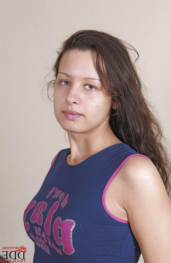 15P Naughty brunette teen undressing and exposing her goods in close up