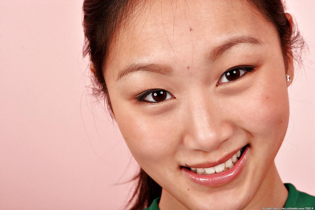 16P Asian amateur Evelyn Lin removes cheerleader uniform to expose tiny tits