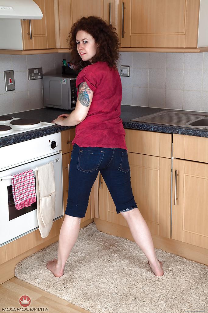 16P Mature brunette woman Candy revealing hairy snatch while disrobing in kitchen