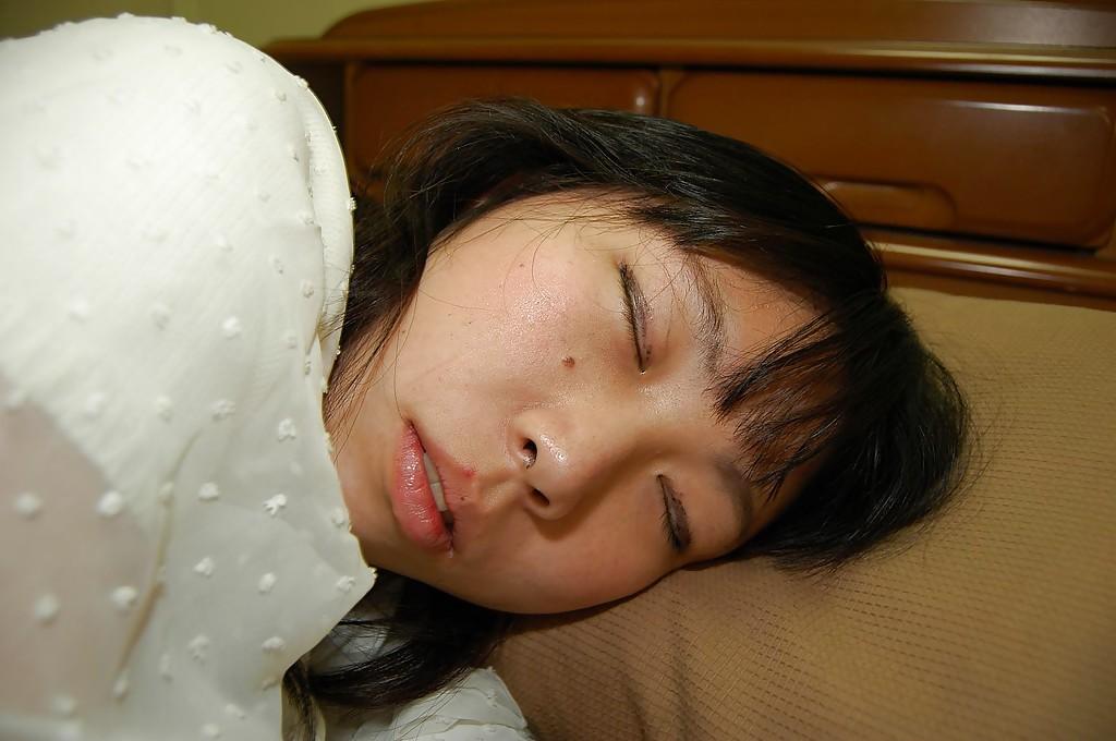 15P Awesome brunette asian teen Noriko is showing her amazing pussy