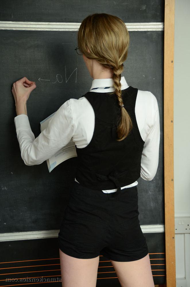 15P Skinny blonde bookworm in glasses getting nude in the classroom