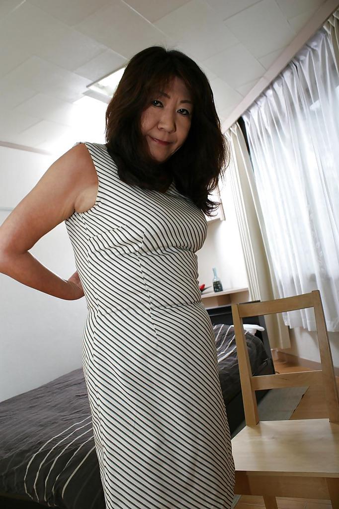 16P Asian granny Michiko Okawa undressing and exposing her hairy twat in close up