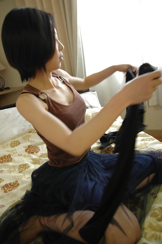 16P Smiley asian babe undresses and exposes her nipples and slit in close up