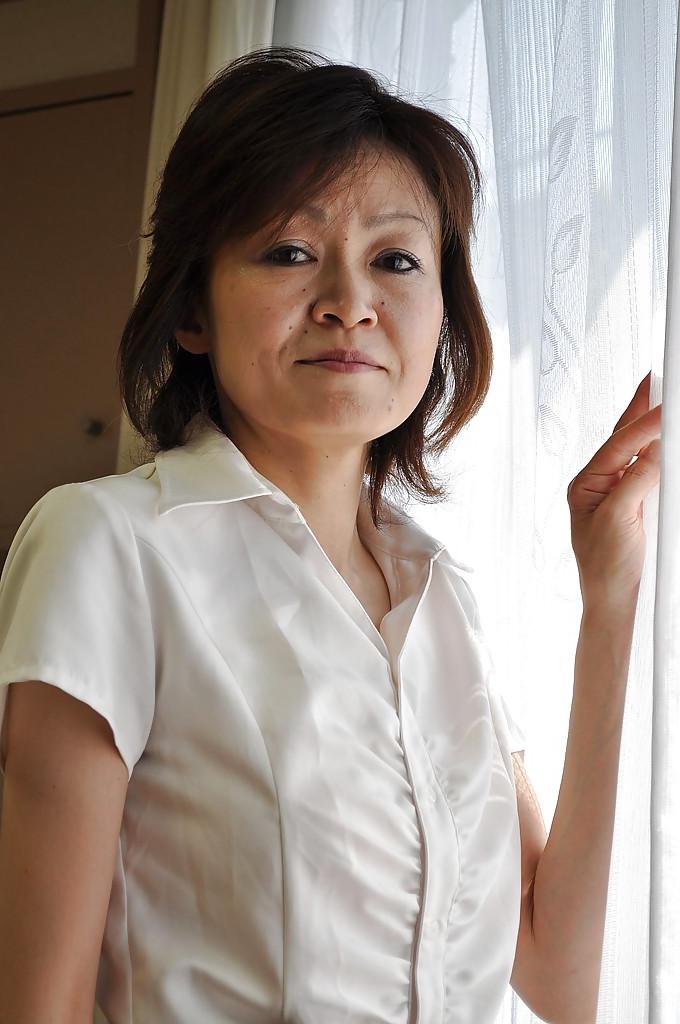 16P Shy mature asian lady Takako Kumagaya undressing and spreading her legs