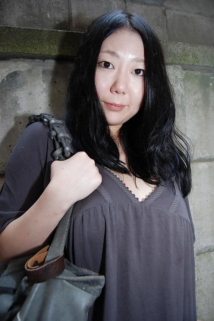 16P Well-stacked asian lassie undressing and exposing her juicy twat in close up
