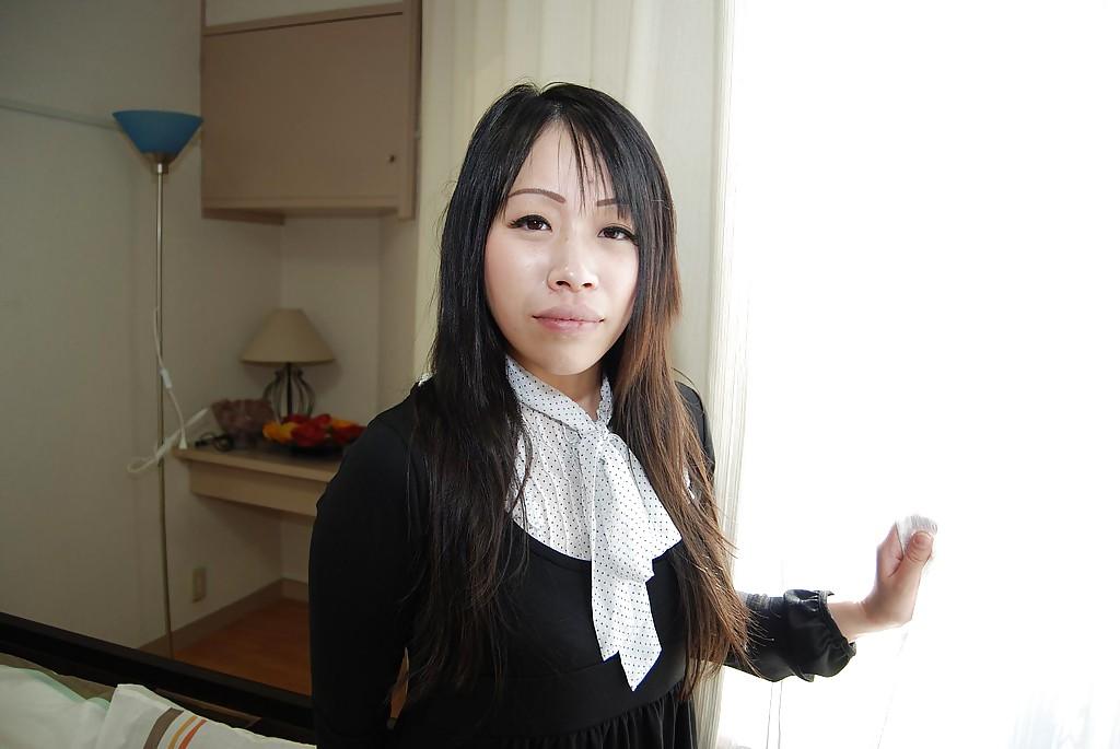 16P Smiley asian teen in pantyhose getting nude and teasing her hairy slit
