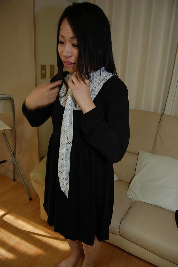 16P Smiley asian teen in pantyhose getting nude and teasing her hairy slit