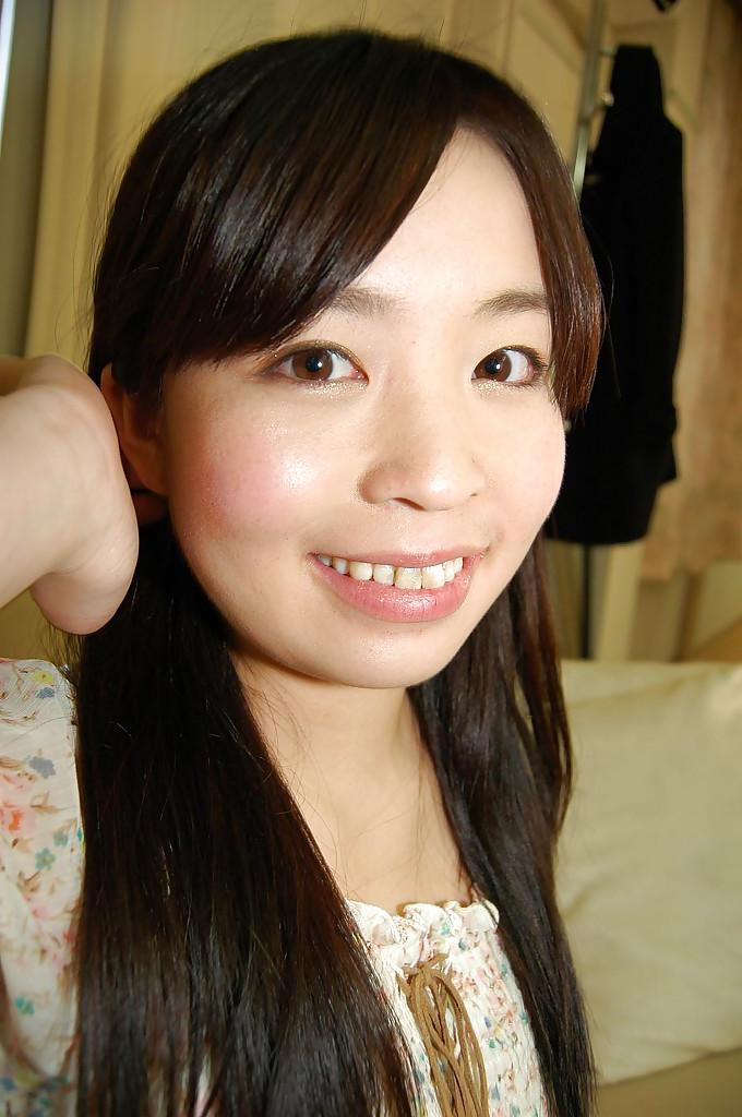 16P Smiley asian teen in stockings undressing and spreading her hairy pussy lips