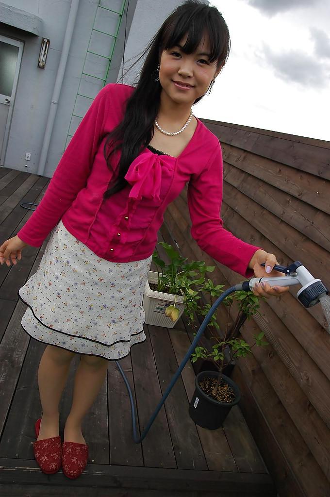 15P Asian teen Nao Kodaka undressing and spreading her pussy lips