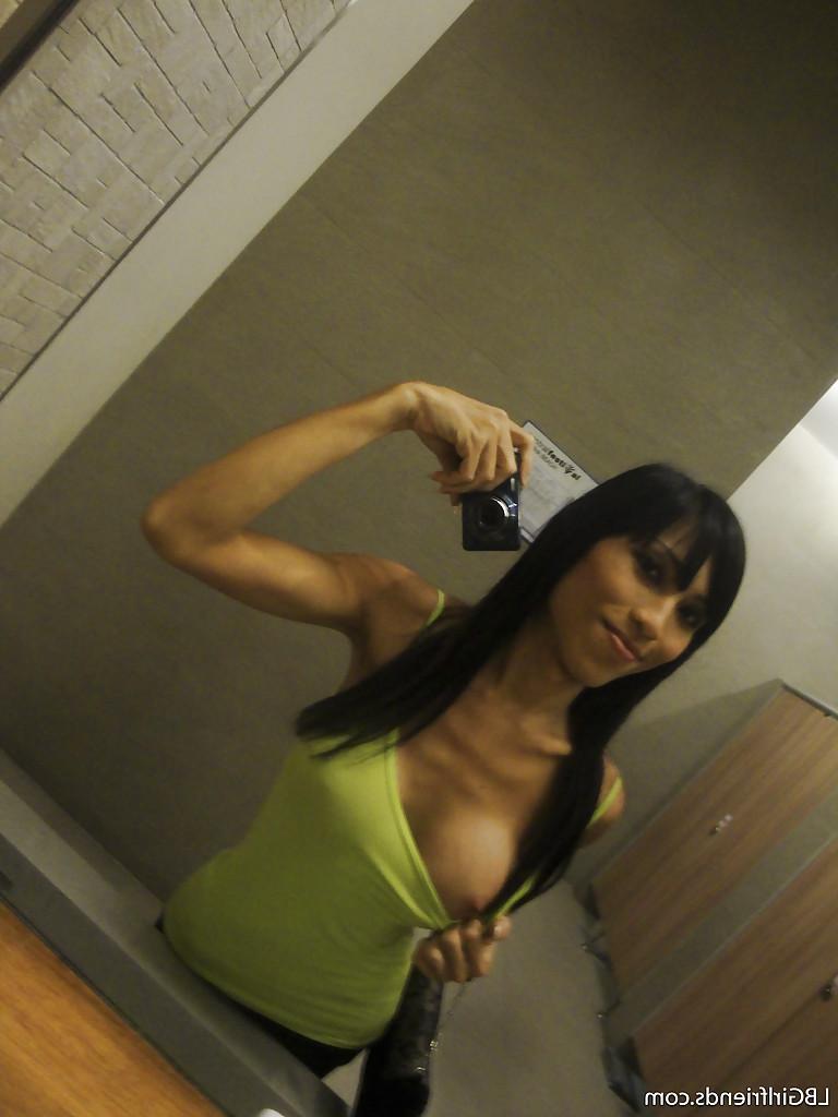 16P Big tit Asian tranny Fon posing outdoors and flashing her boobs in public